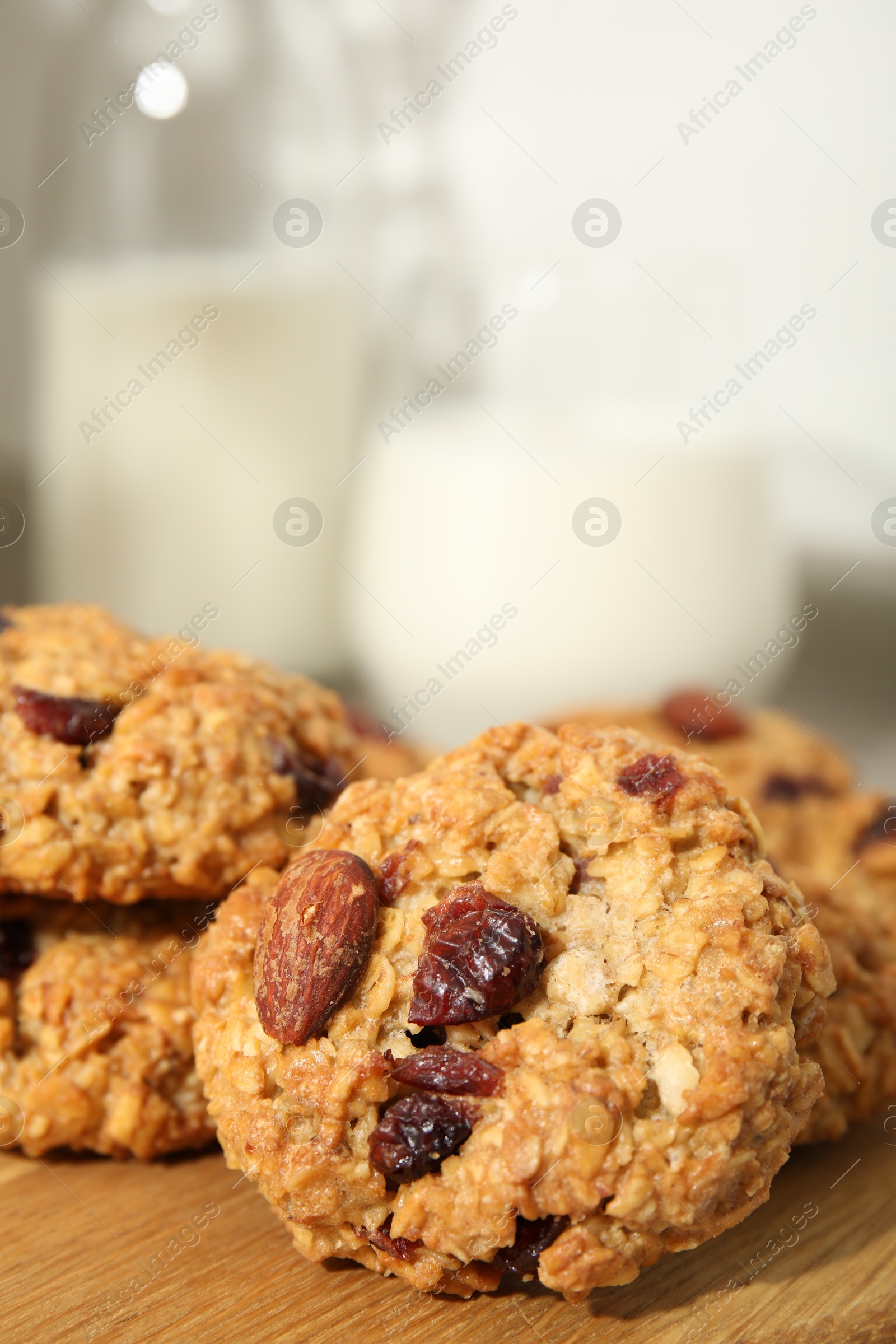 Photo of Delicious oatmeal cookies with raisins and nuts on table, closeup