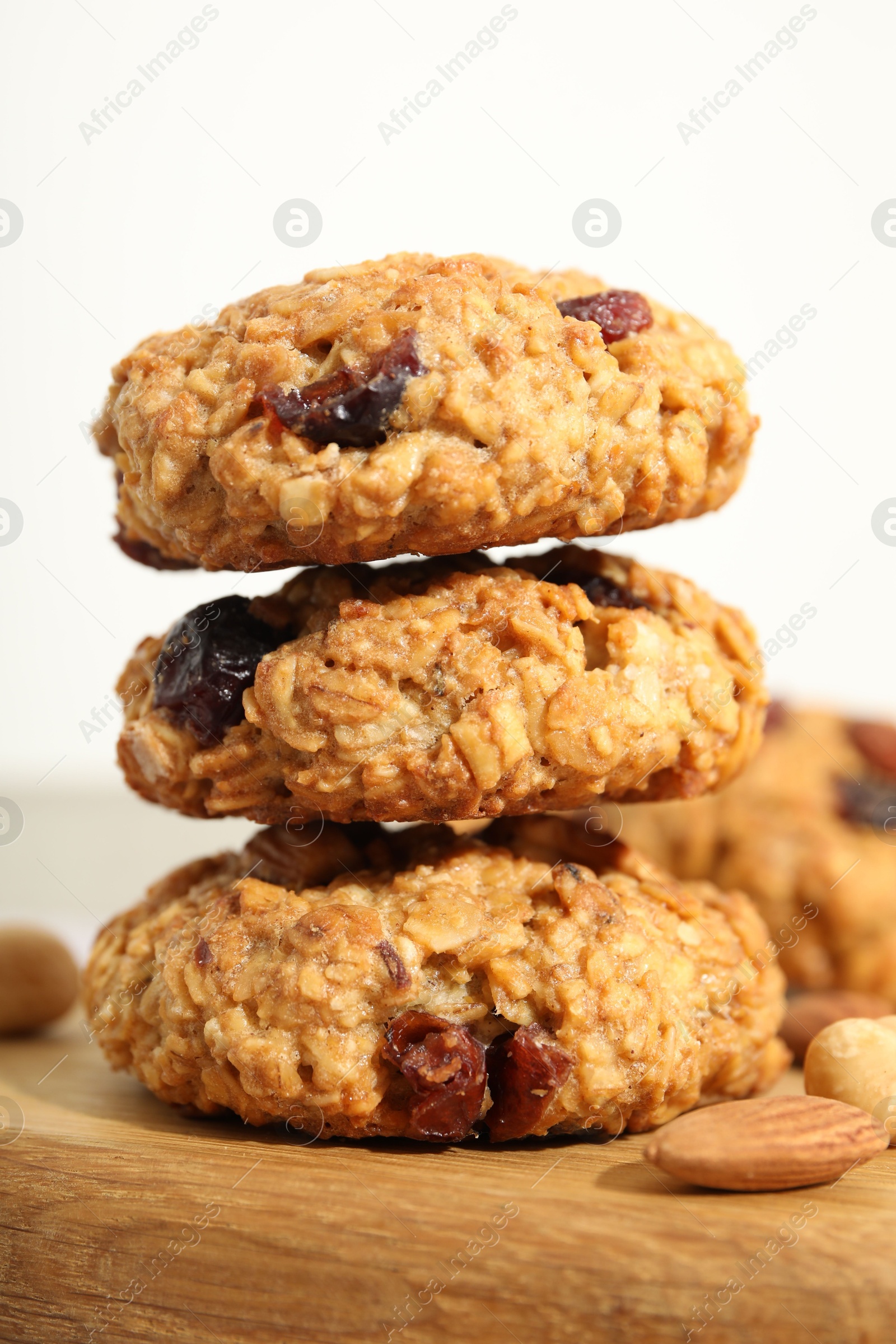 Photo of Delicious oatmeal cookies with raisins and nuts on table, closeup