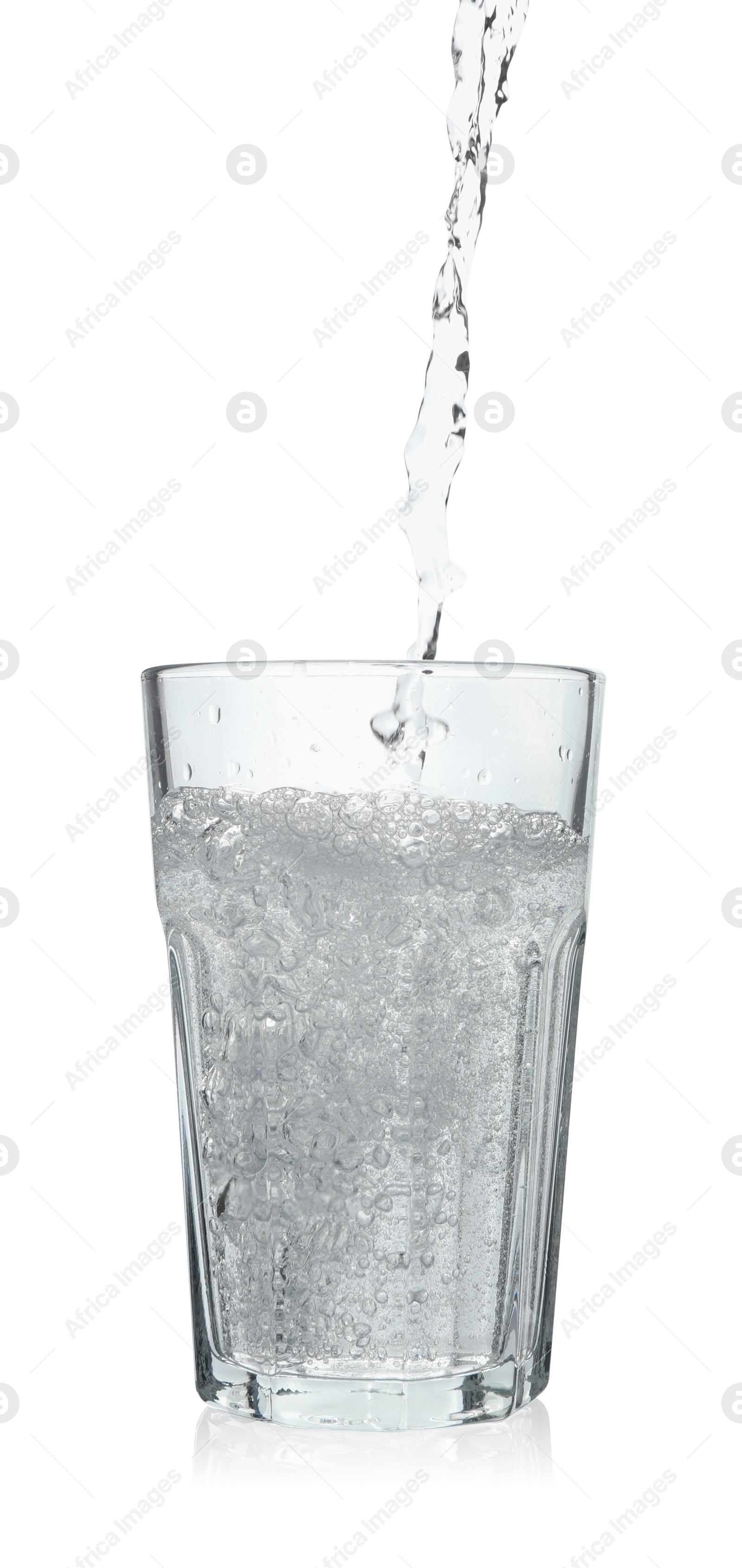 Photo of Pouring soda water into glass on white background