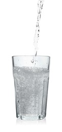 Pouring soda water into glass on white background