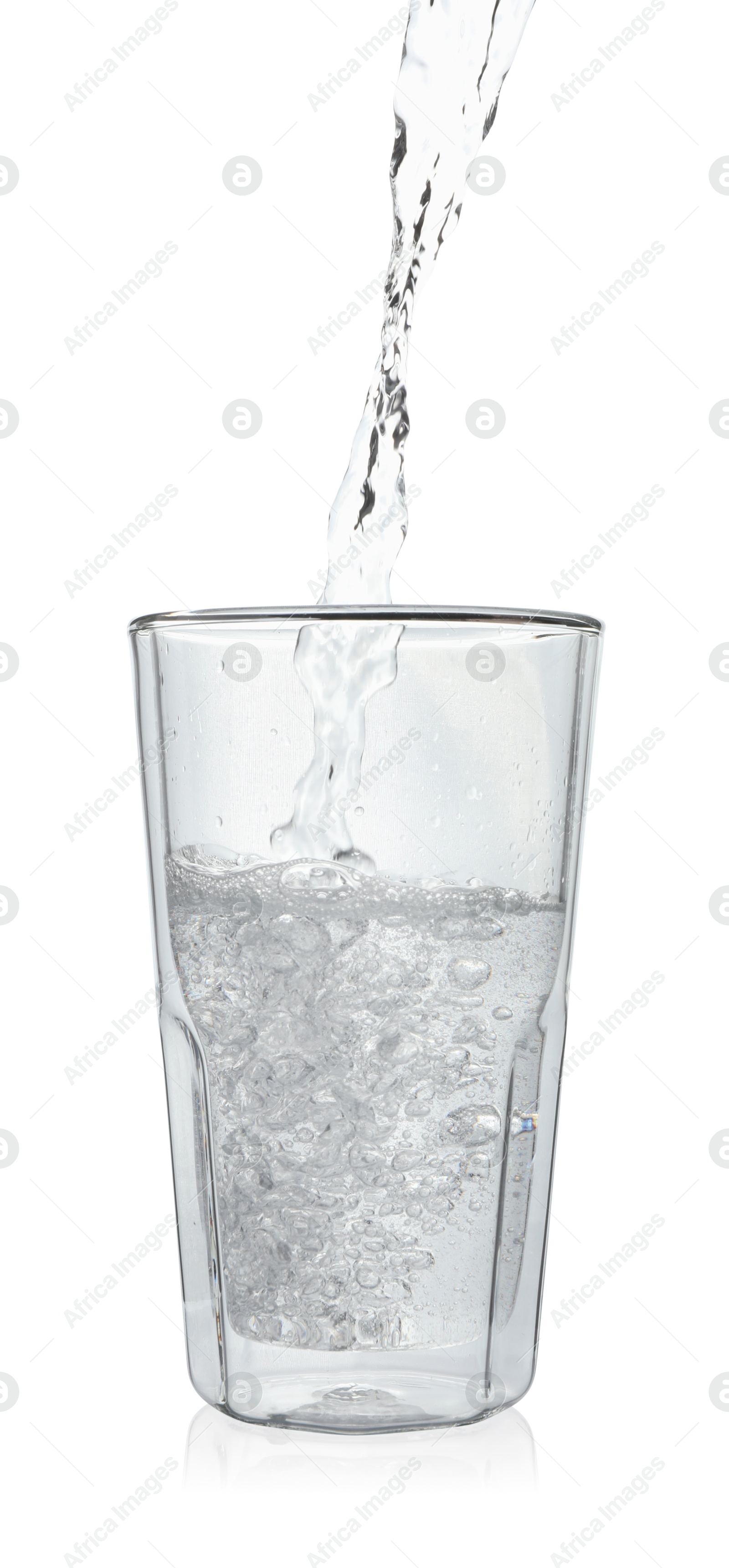 Photo of Pouring soda water into glass on white background