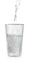 Pouring soda water into glass on white background