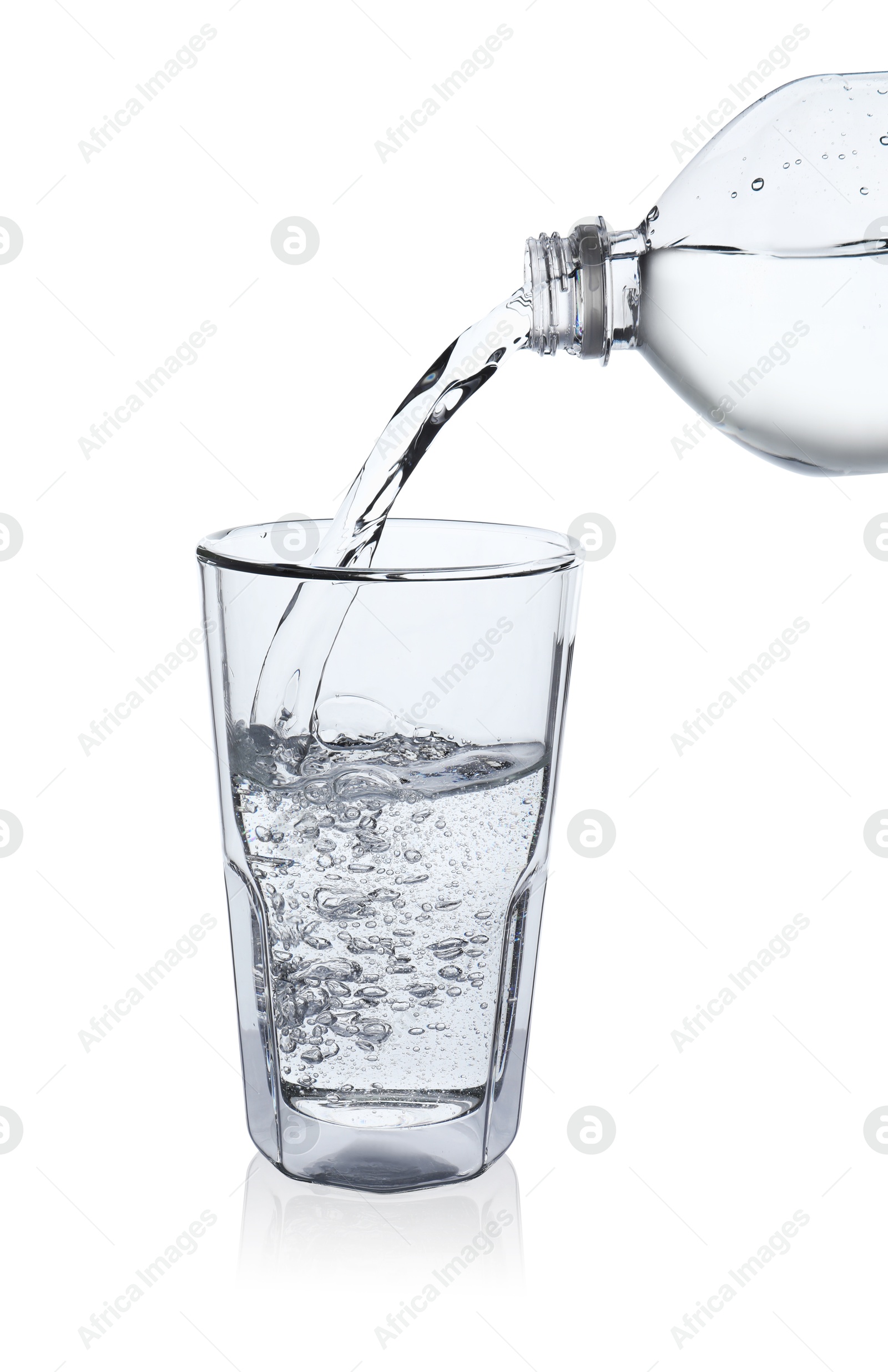 Photo of Pouring soda water from bottle into glass on white background