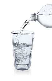 Photo of Pouring soda water from bottle into glass on white background