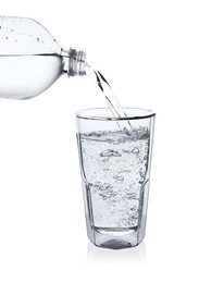 Photo of Pouring soda water from bottle into glass on white background