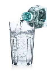 Photo of Pouring soda water from bottle into glass on white background