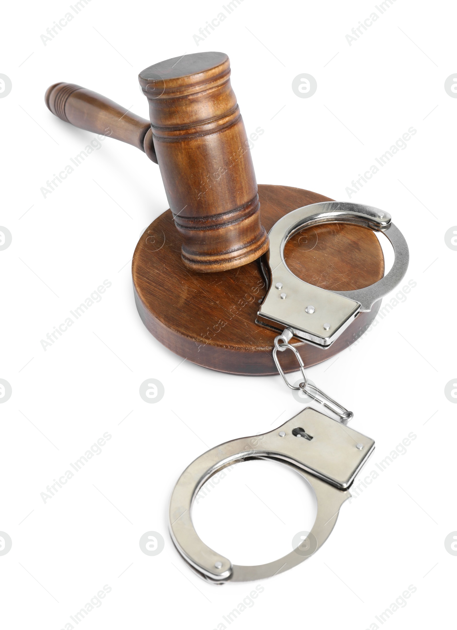 Photo of Handcuffs and judge's gavel isolated on white