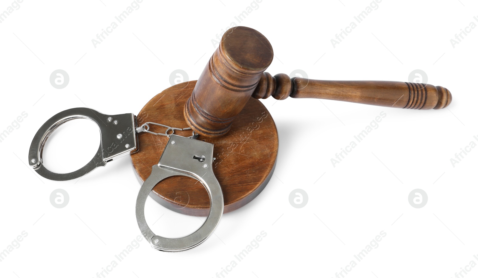 Photo of Handcuffs and judge's gavel isolated on white