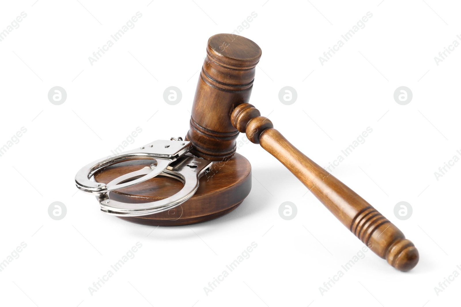 Photo of Handcuffs and judge's gavel isolated on white