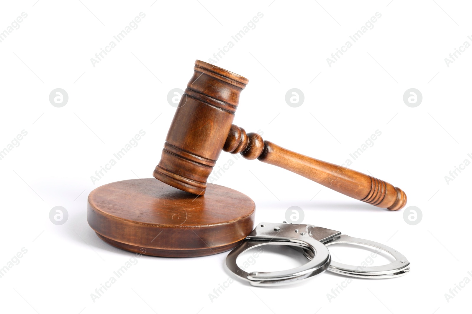 Photo of Handcuffs and judge's gavel isolated on white