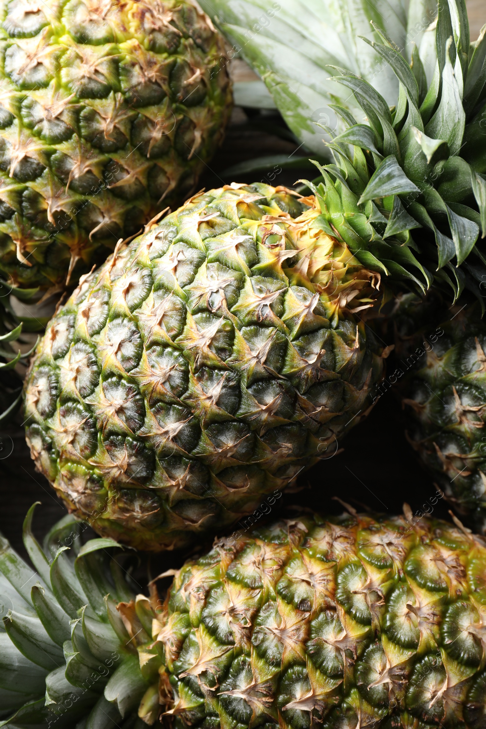 Photo of Fresh ripe pineapples as background, closeup view