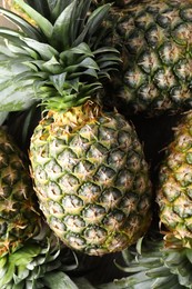 Fresh ripe pineapples as background, top view