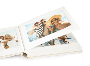 Photo of Open photo album with different photos isolated on white