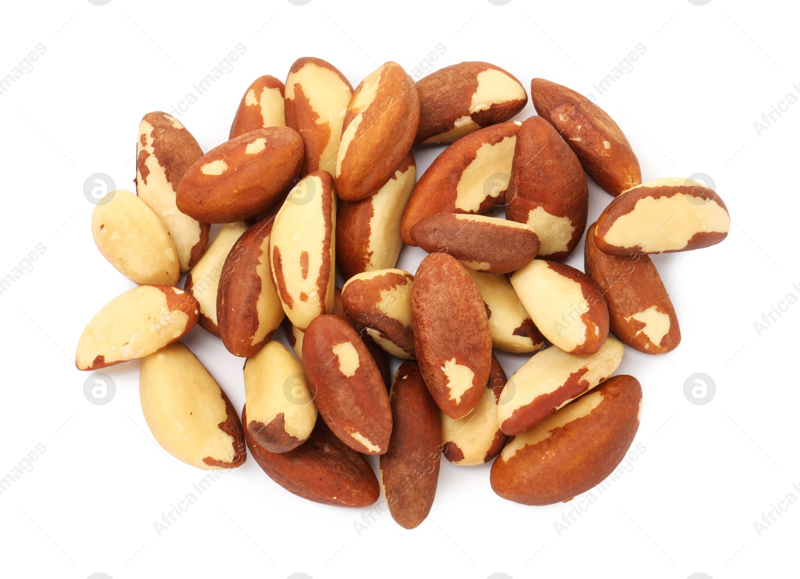 Photo of Heap of Brazil nuts isolated on white, top view