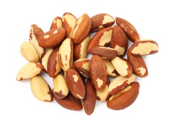 Photo of Heap of Brazil nuts isolated on white, top view