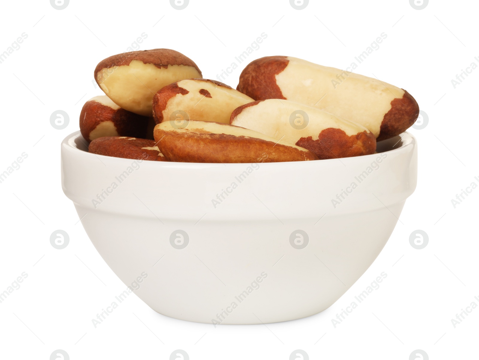 Photo of Tasty Brazil nuts in bowl isolated on white