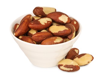 Photo of Tasty Brazil nuts in bowl isolated on white