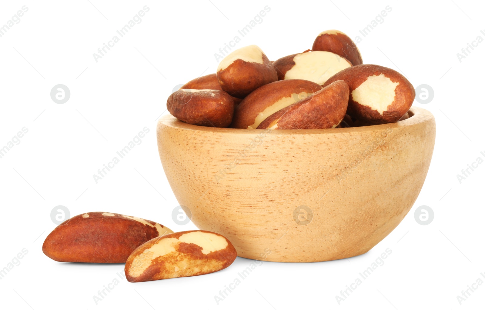 Photo of Tasty Brazil nuts in bowl isolated on white