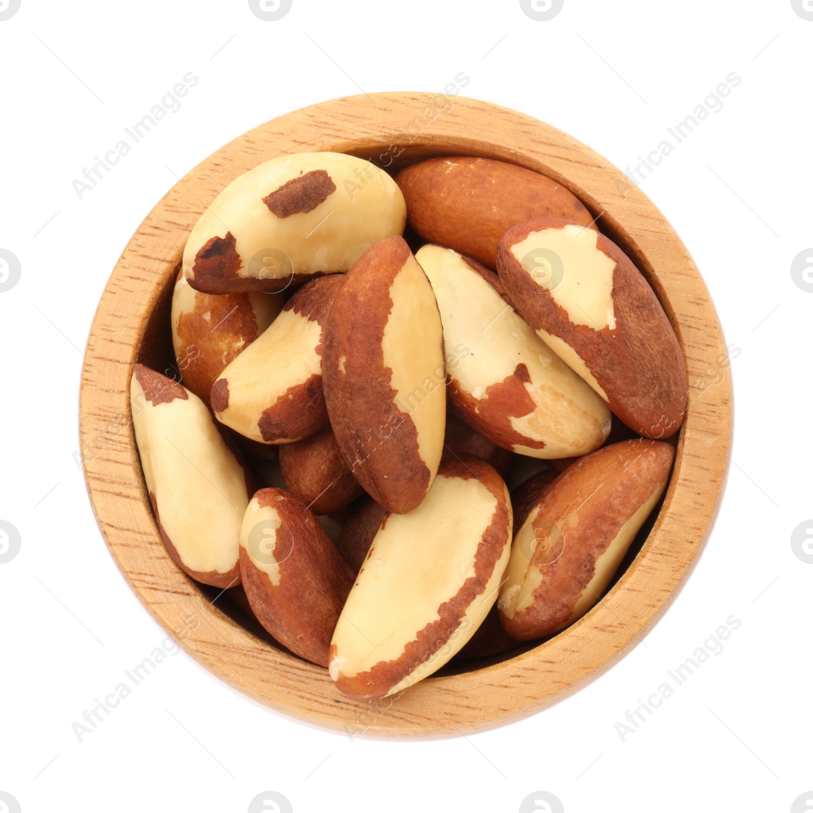 Photo of Tasty Brazil nuts in bowl isolated on white, top view