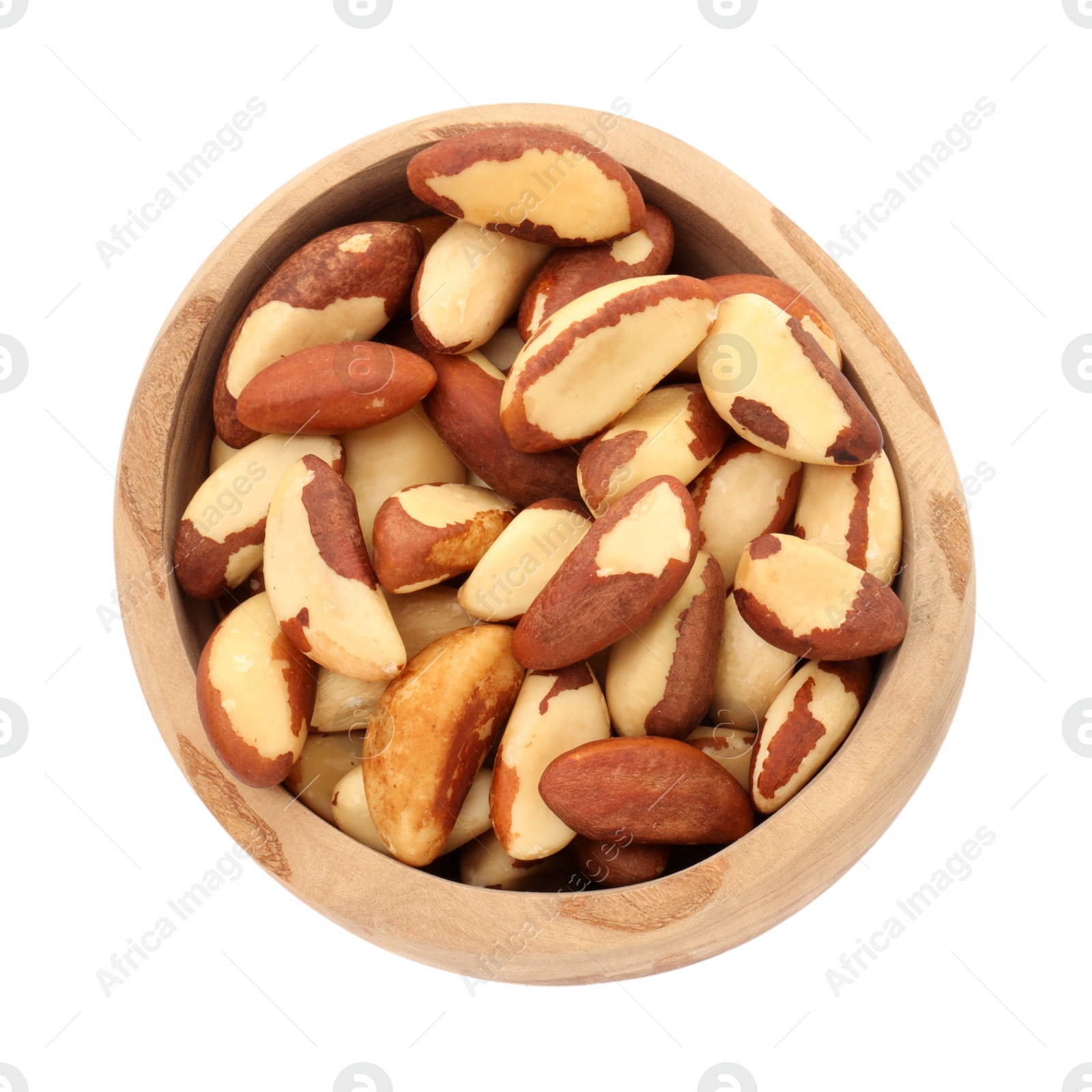 Photo of Tasty Brazil nuts in bowl isolated on white, top view