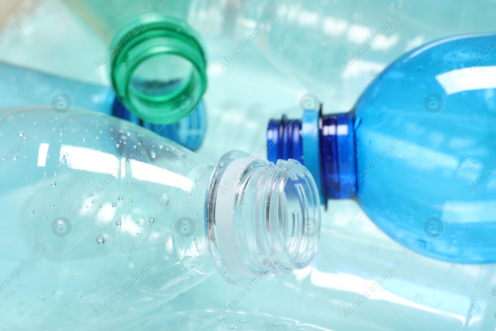 Photo of Many plastic bottles as background, closeup view