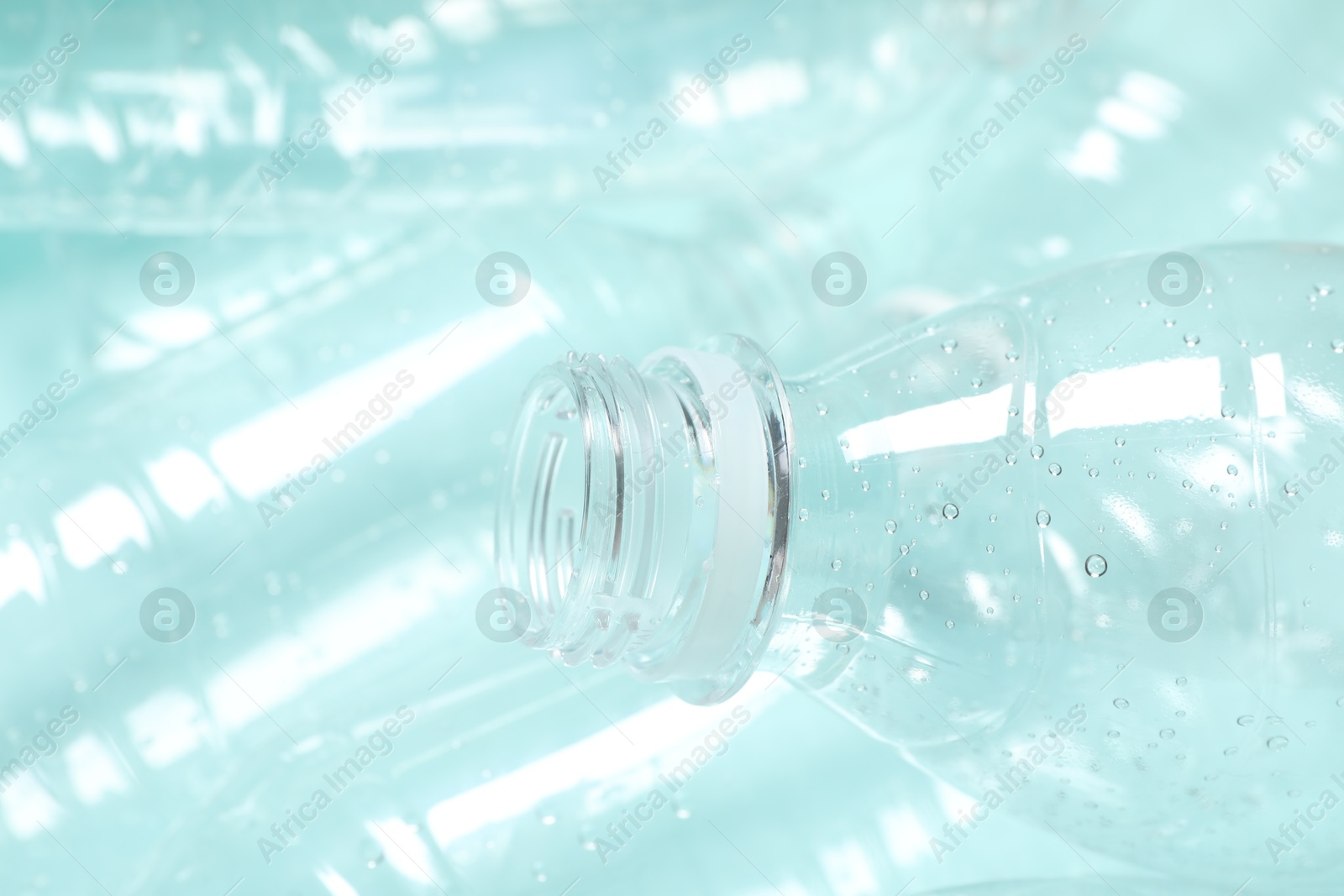 Photo of Many plastic bottles as background, closeup view