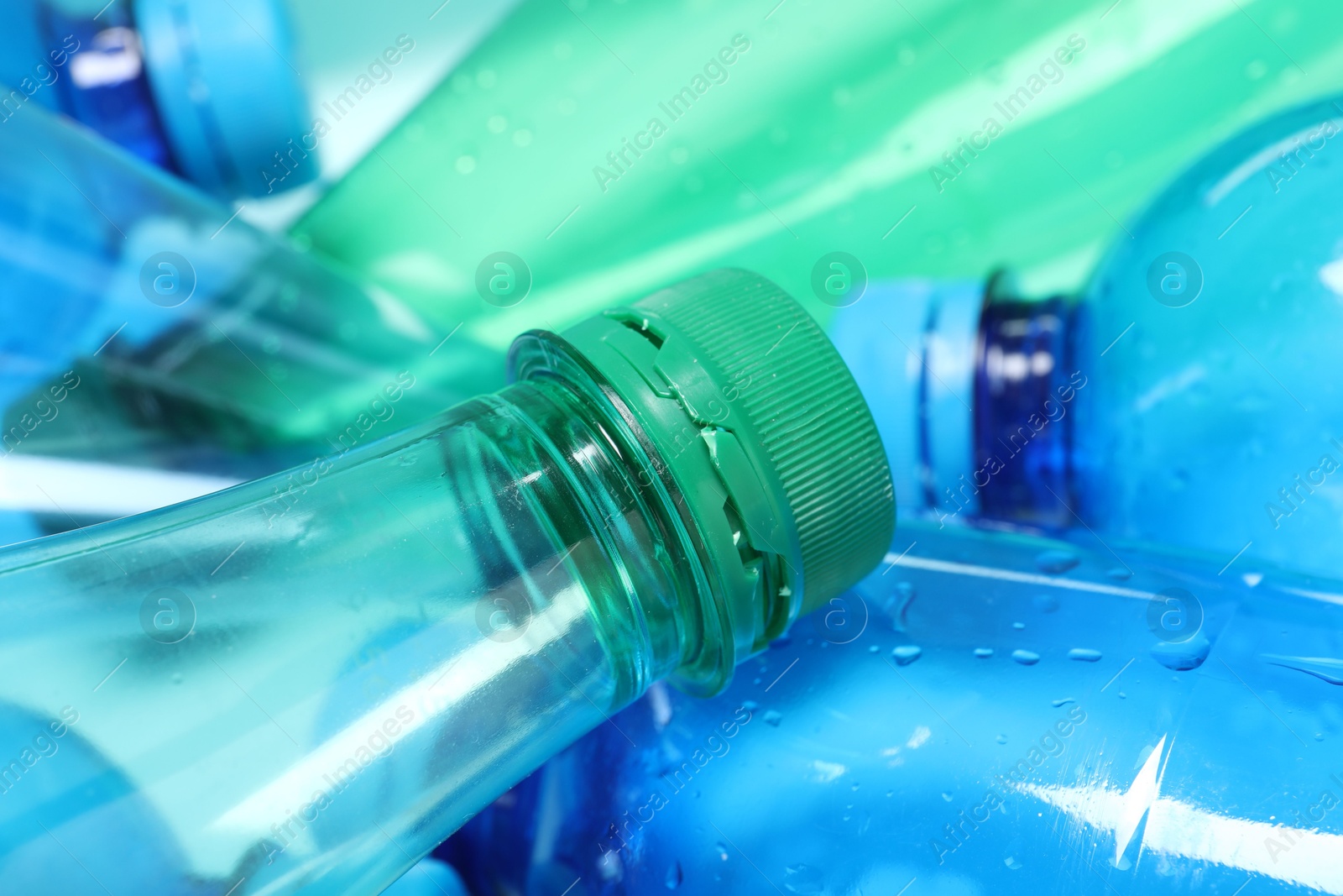 Photo of Many plastic bottles as background, closeup view