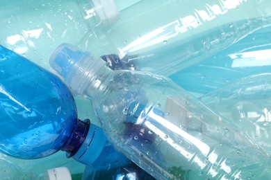 Photo of Many plastic bottles as background, closeup view