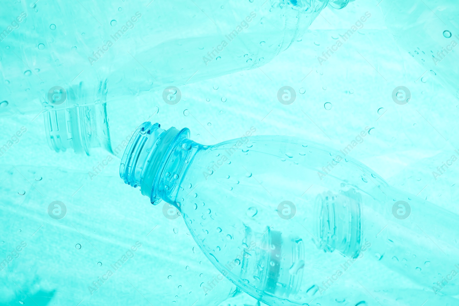 Photo of Many plastic bottles as background, closeup view