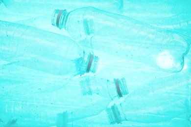 Photo of Many plastic bottles as background, closeup view