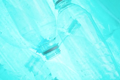 Photo of Many plastic bottles as background, closeup view