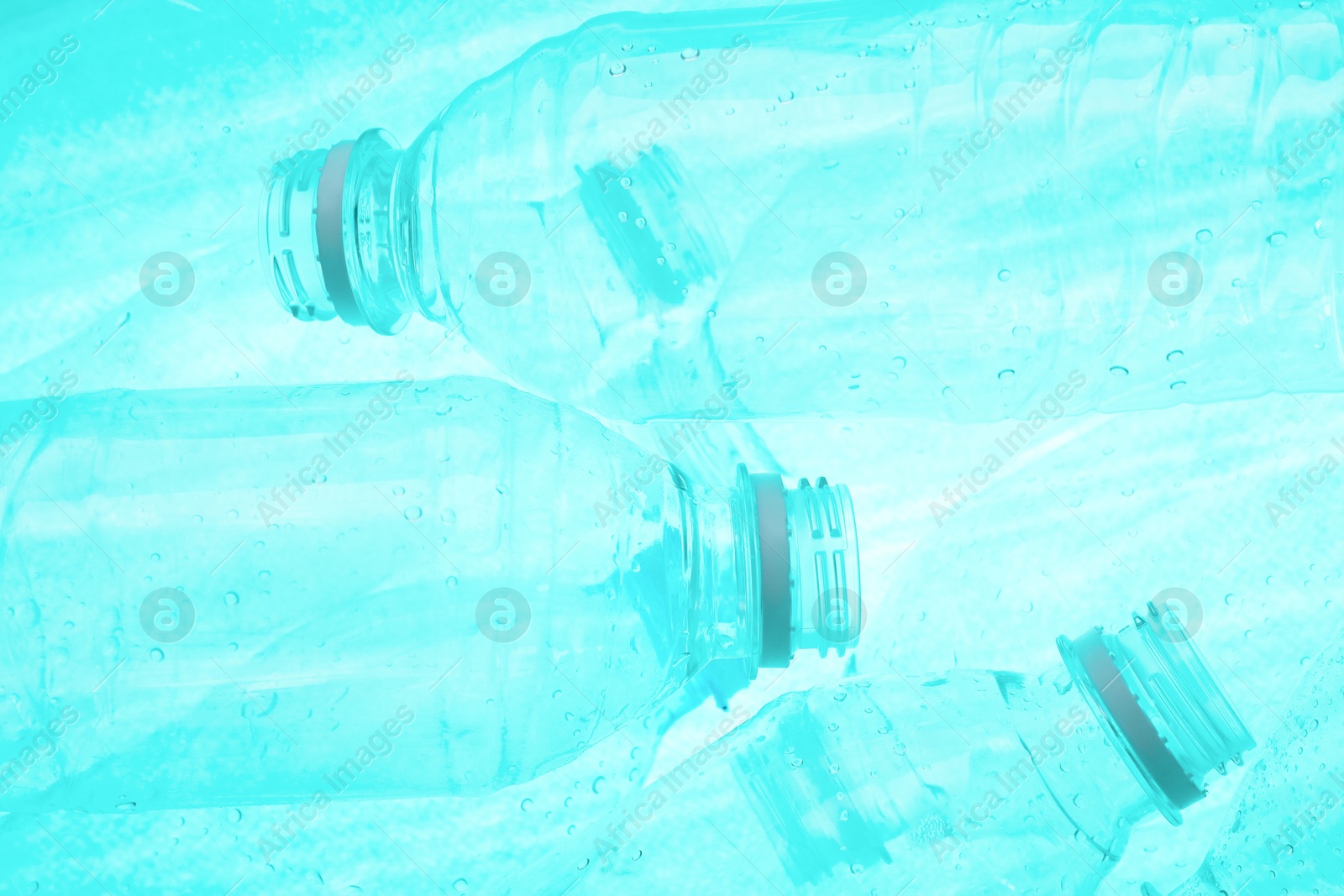 Photo of Many plastic bottles as background, closeup view