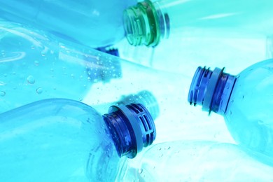 Photo of Many plastic bottles as background, closeup view