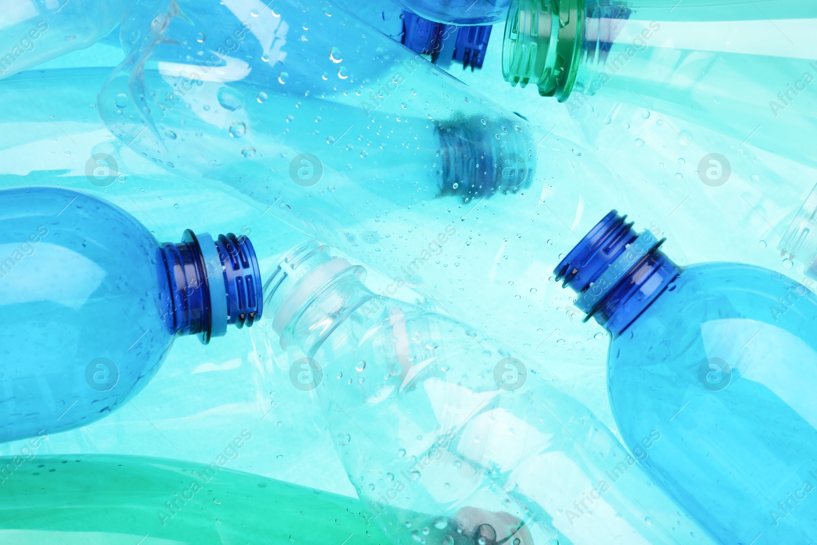 Photo of Many plastic bottles as background, closeup view