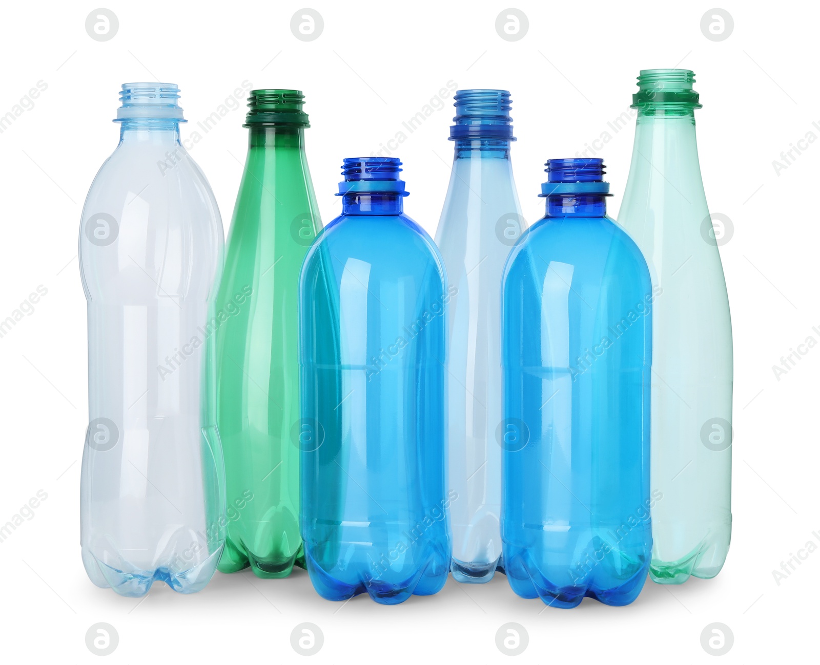 Photo of Many empty plastic bottles isolated on white