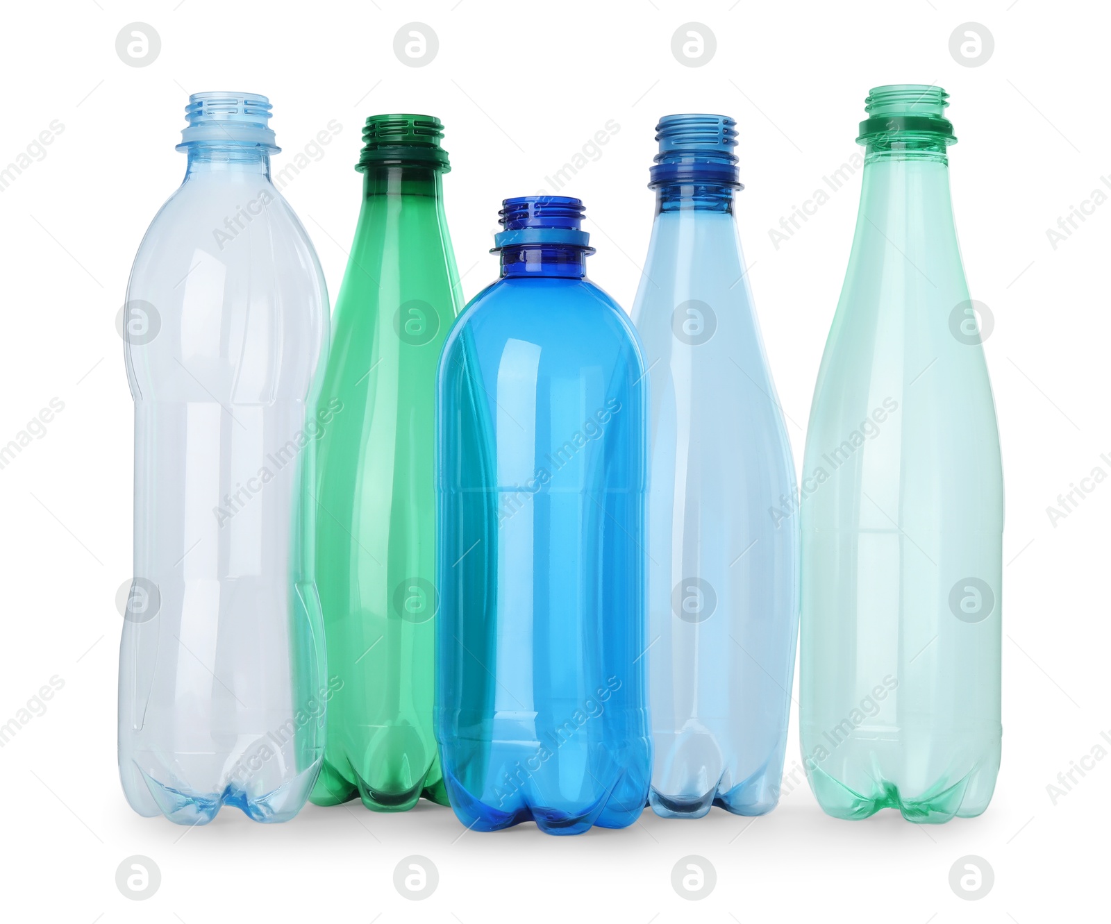 Photo of Many empty plastic bottles isolated on white