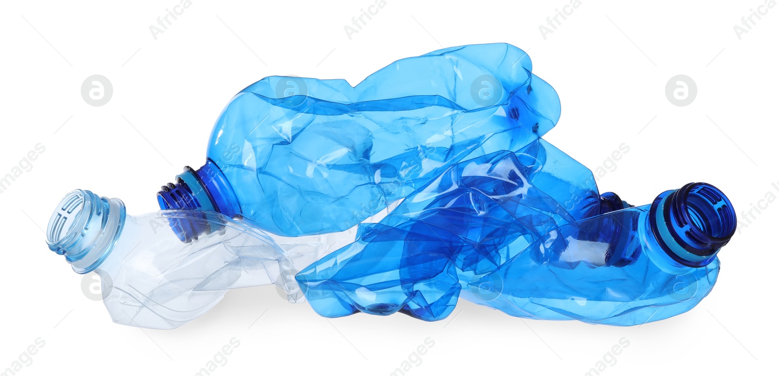 Photo of Crumpled empty plastic bottles isolated on white