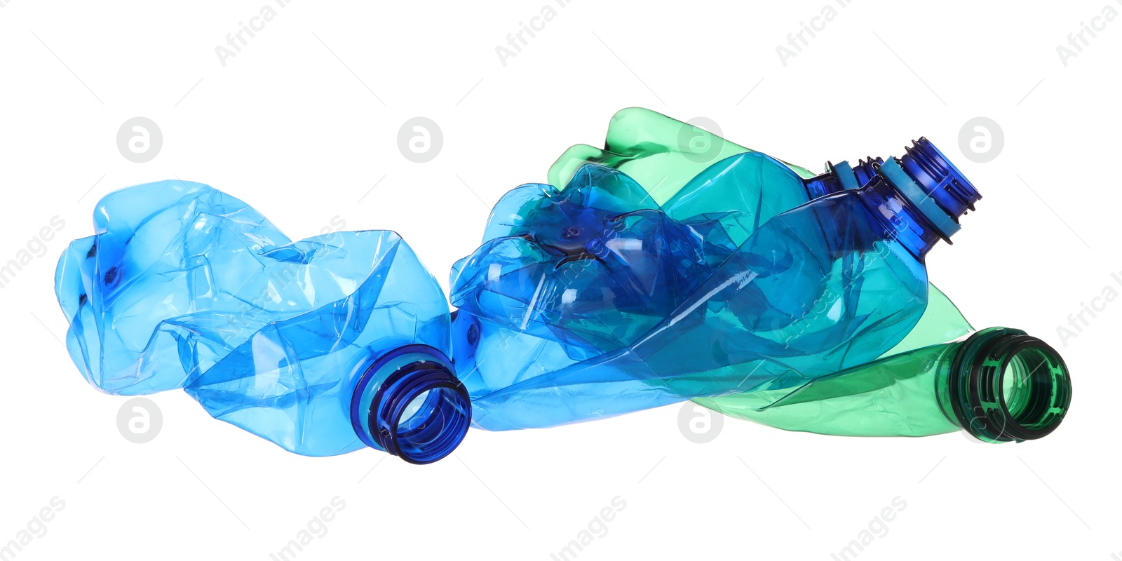 Photo of Crumpled empty plastic bottles isolated on white