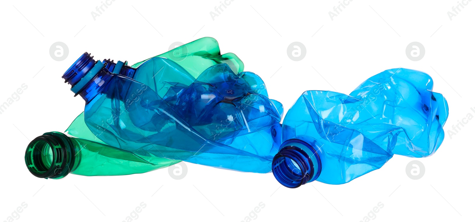 Photo of Crumpled empty plastic bottles isolated on white