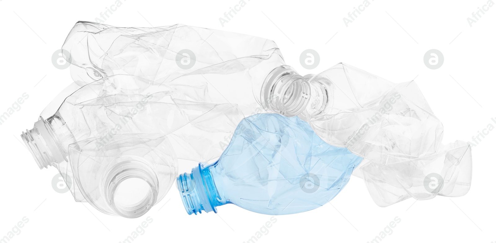 Photo of Crumpled empty plastic bottles isolated on white