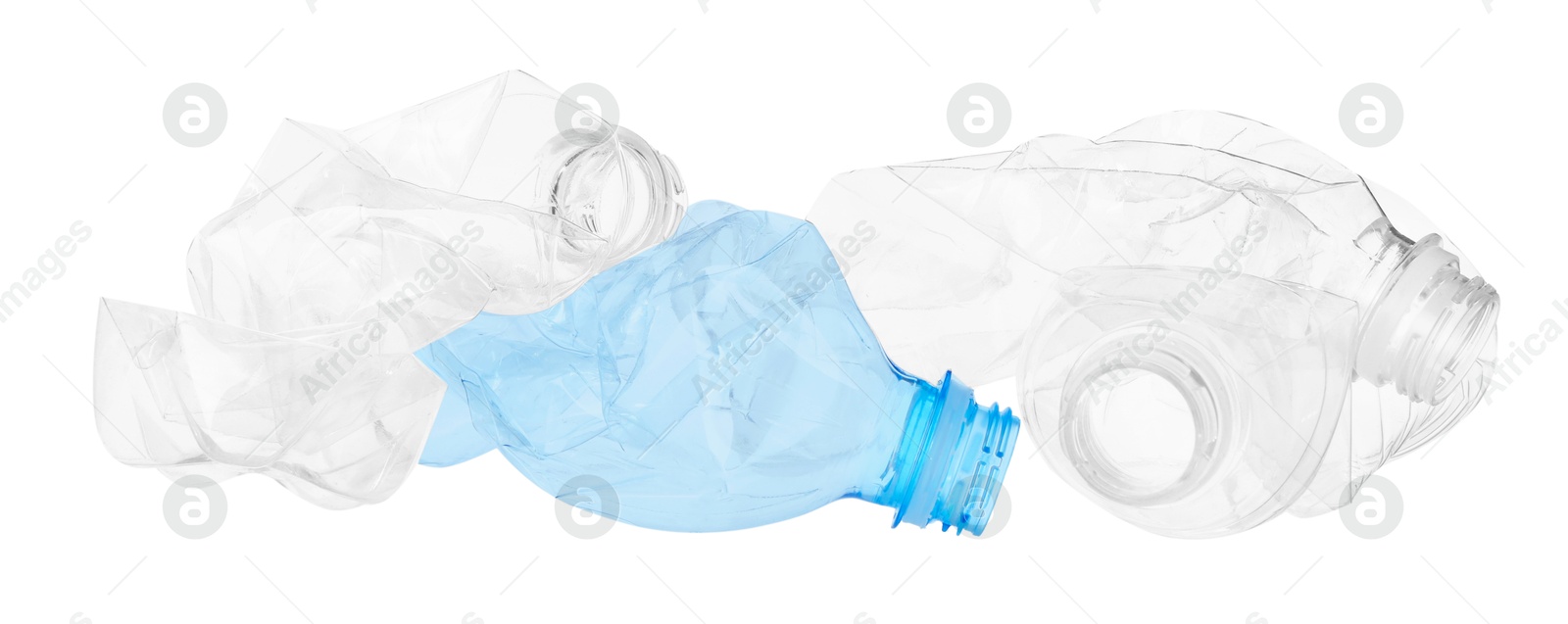 Photo of Crumpled empty plastic bottles isolated on white