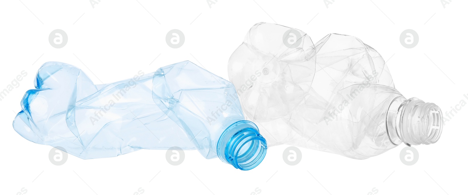 Photo of Crumpled empty plastic bottles isolated on white