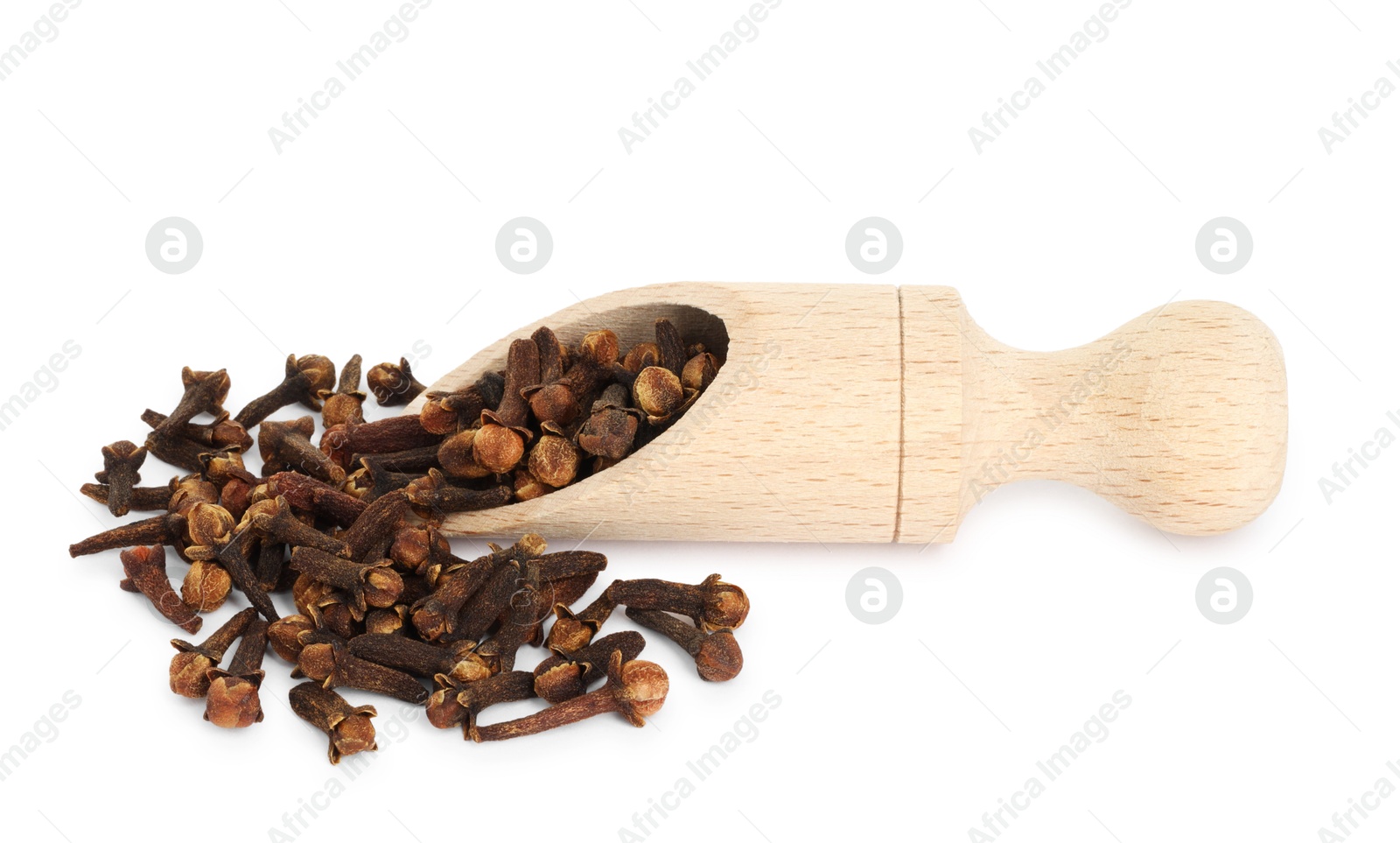 Photo of Dry clove buds in wooden scoop on white background. Aromatic spice