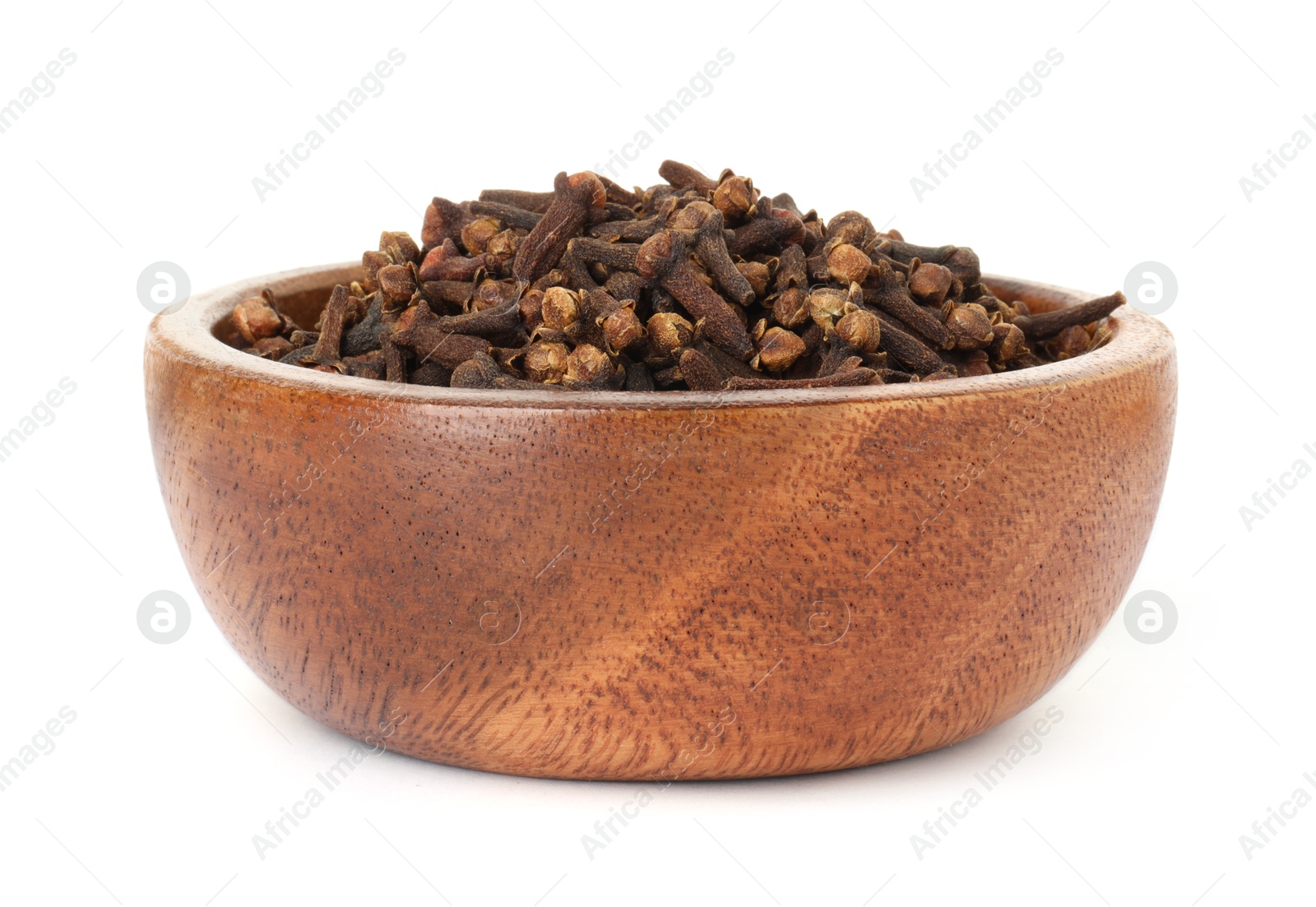 Photo of Dry clove buds in wooden bowl on white background. Aromatic spice