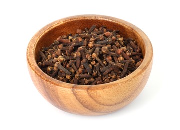 Photo of Dry clove buds in wooden bowl on white background. Aromatic spice