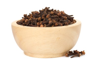 Photo of Dry clove buds in wooden bowl on white background. Aromatic spice