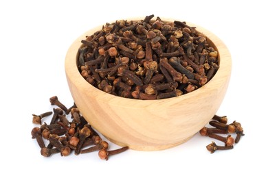 Photo of Dry clove buds in wooden bowl on white background. Aromatic spice