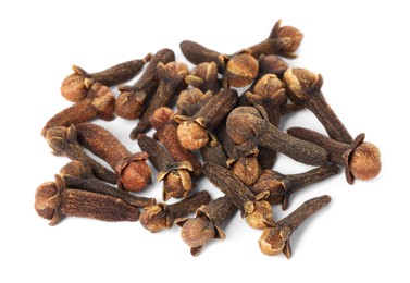 Photo of Pile of dry clove buds on white background. Aromatic spice