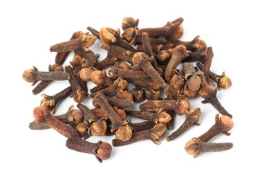 Photo of Pile of dry clove buds on white background. Aromatic spice