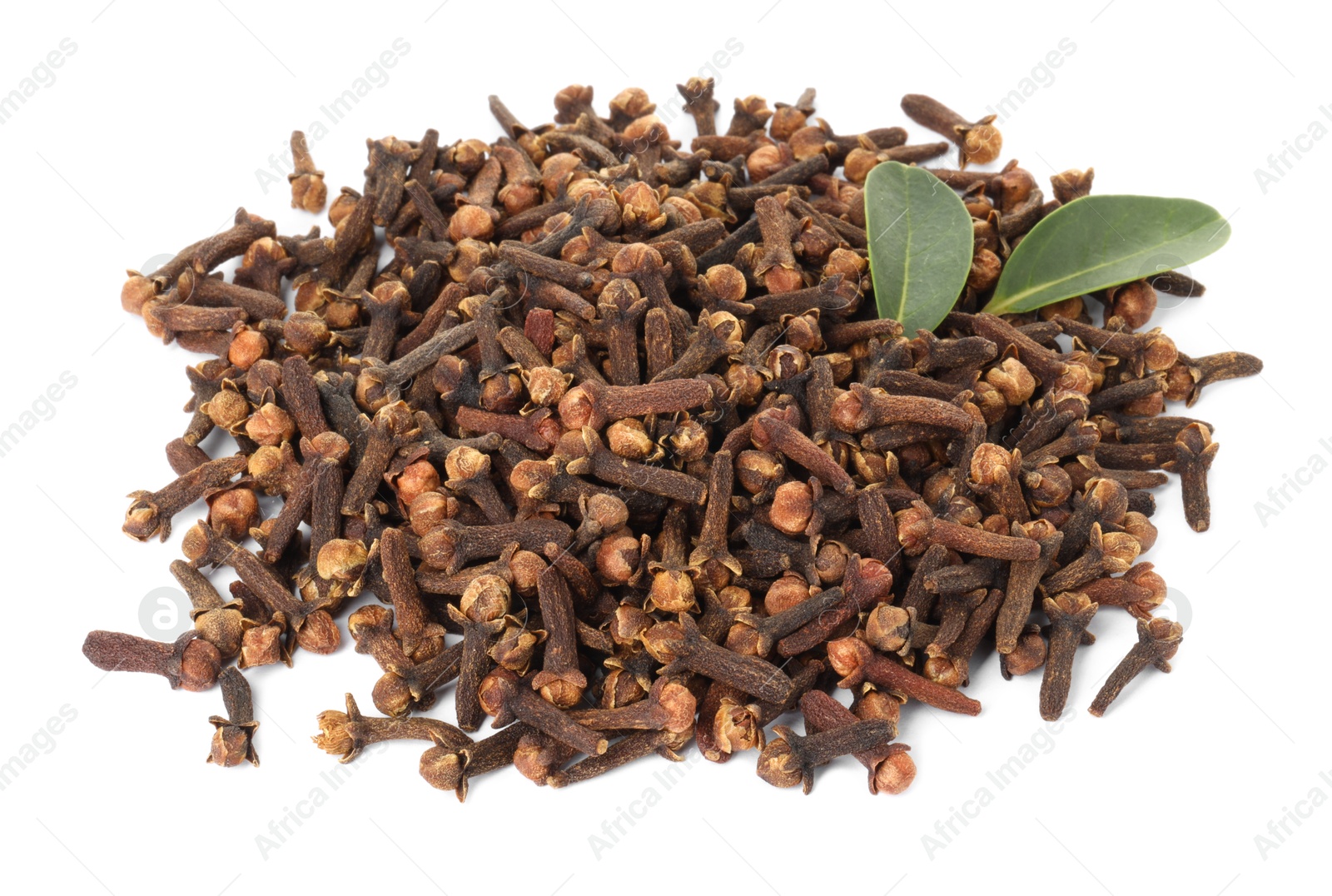 Photo of Pile of dry clove buds and green leaves on white background. Aromatic spice